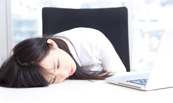 Tired Japanese business woman